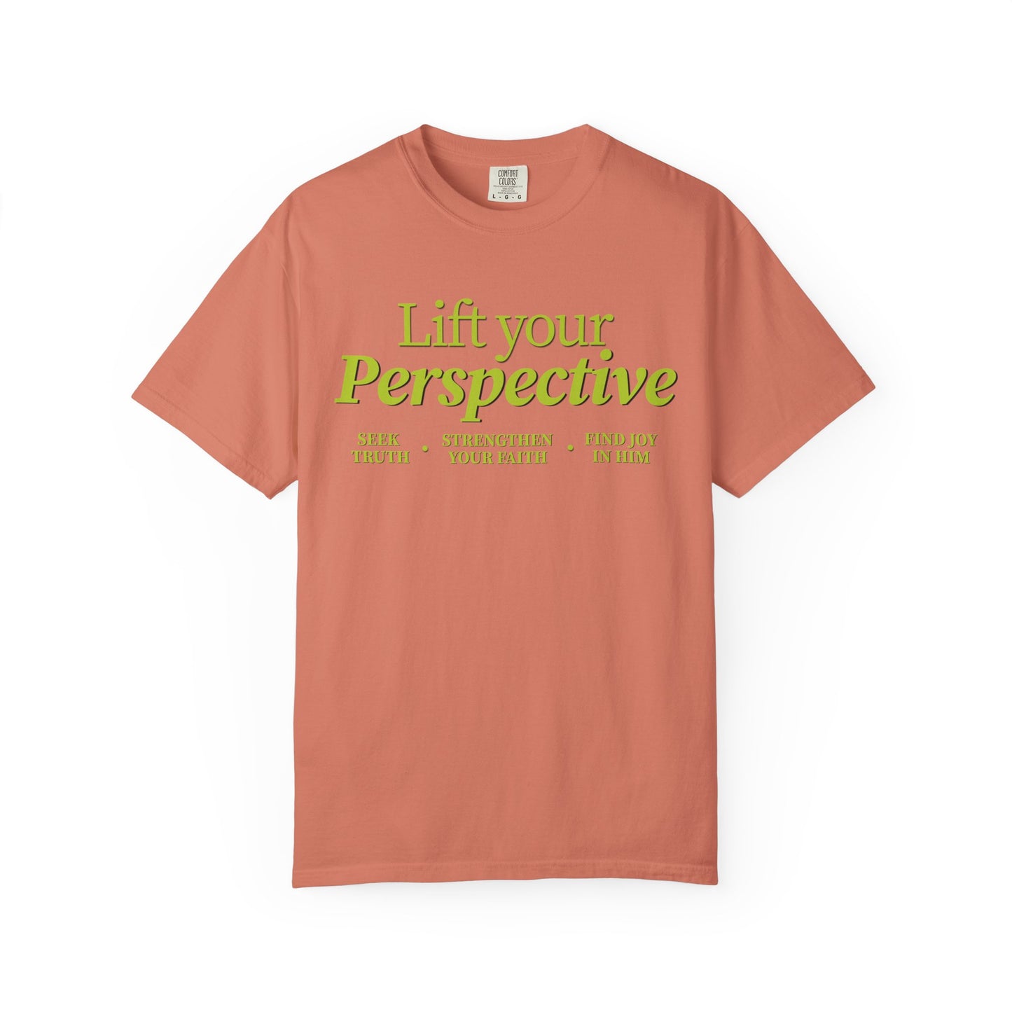 Young adult wearing “Lift Your Perspective” Christian T-shirt in terracotta, inspired by the How to Pray series.