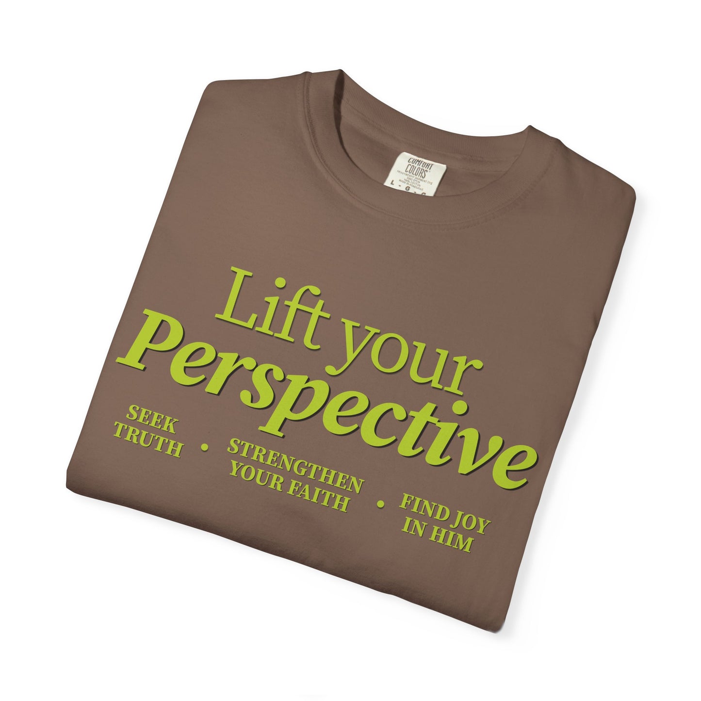 Young adult wearing “Lift Your Perspective” Christian T-shirt in brown, inspired by the How to Pray series.