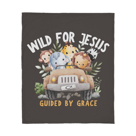 Dark brown blanket with jungle animals in a jeep, 'Wild for Jesus' text, and 'Guided by Grace' beneath in a playful design.