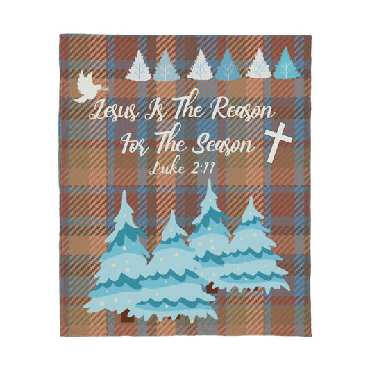 Plaid fleece blanket with winter trees, cross, and 'Jesus Is The Reason For The Season' message with Luke 2:11 Bible verse.