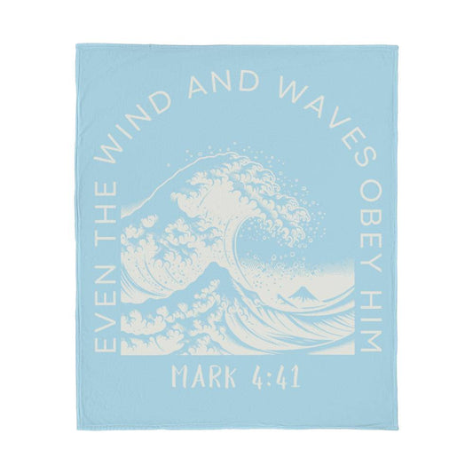 Light blue fleece blanket with white text, featuring 'Even the Wind & Waves Obey Him' with ocean wave design and Mark 4:41.