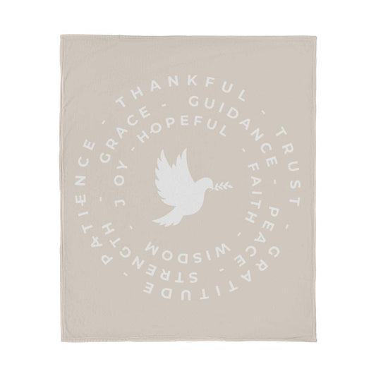 Fleece blanket with a dove at the center, surrounded by circles of words like 'Thankful,' 'Peace,' 'Joy,' and 'Faith,' on a warm background.