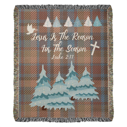 Woven Plaid design blanket with winter trees, cross, and 'Jesus Is The Reason For The Season' message with Luke 2:11 Bible verse.