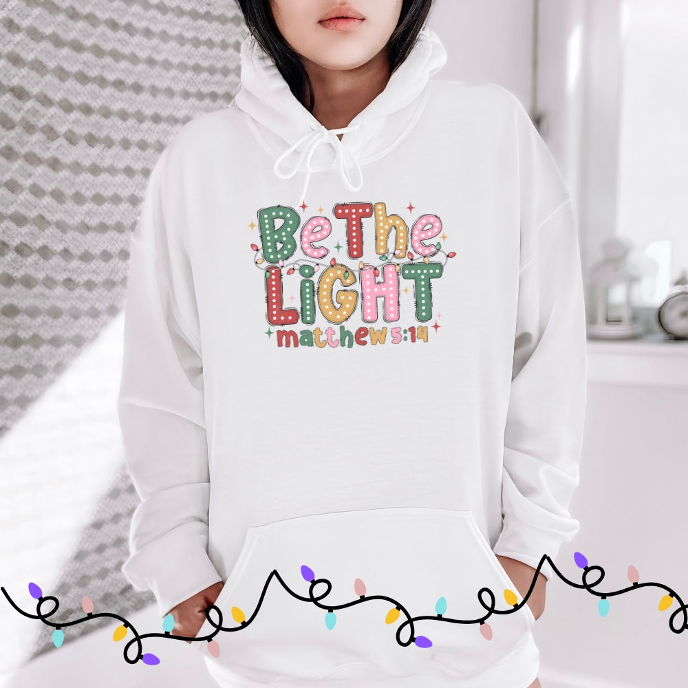 White Christian Christmas hoodie with bubble font and festive lights