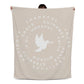 Fleece blanket with a dove at the center, surrounded by circles of words like 'Thankful,' 'Peace,' 'Joy,' and 'Faith,' on a warm background.
