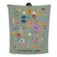 Floral fleece blanket with vibrant flowers, bugs, and 'Find Peace in God's Garden' message. Colorful and nature-inspired Christian blanket.
