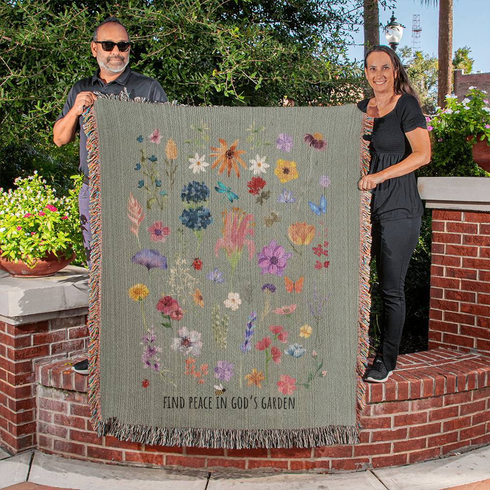 Floral woven blanket with vibrant flowers, bugs, and 'Find Peace in God's Garden' message. Colorful and nature-inspired Christian blanket.
