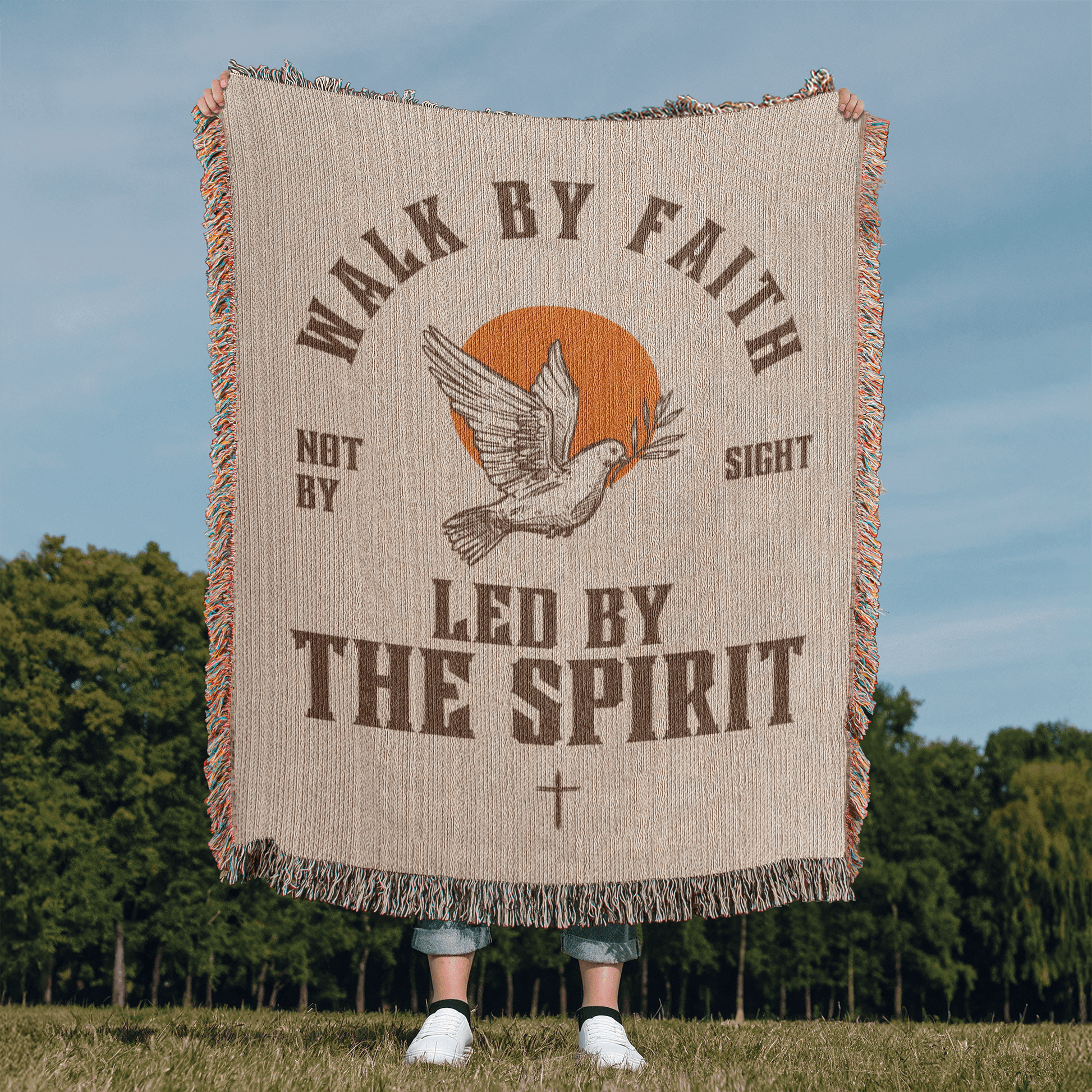 Retro-inspired woven blanket with 'Walk by Faith, Not by Sight' message, dove and sun design, light background, and retro colors.
