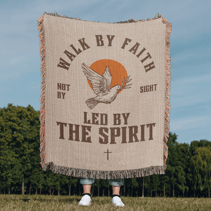 Retro-inspired woven blanket with 'Walk by Faith, Not by Sight' message, dove and sun design, light background, and retro colors.
