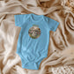 Jesus Loves Me Christian bodysuit with bunny in a flower garden.
