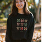 Christian Christmas sweatshirt featuring holiday bows and Psalm 23 inspiration
